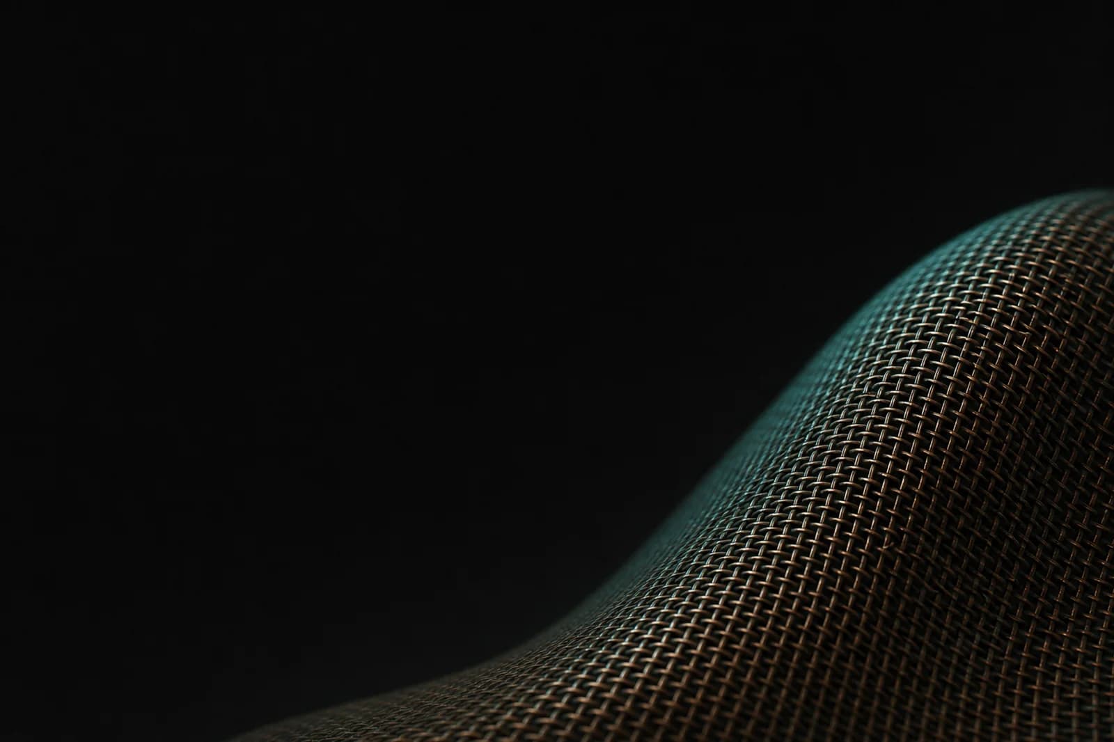Premium dark mesh background with an oxidized bronze wave, teal edge light, and broad black copy space