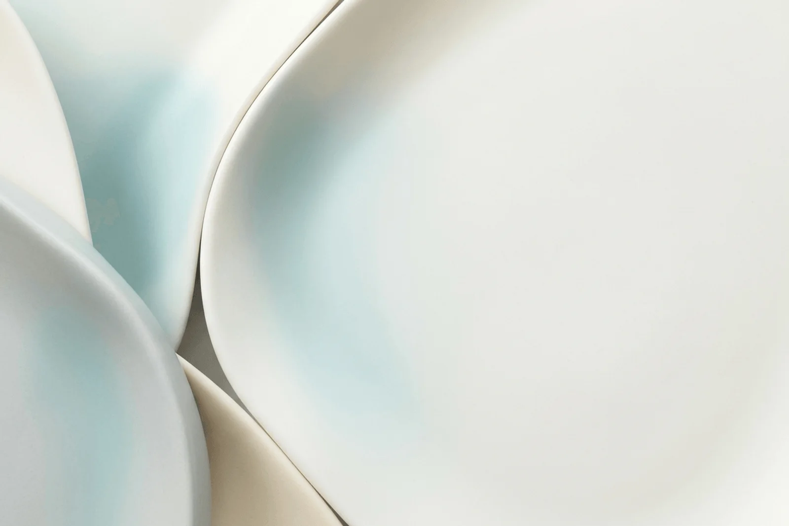 Premium light abstract background with matte ceramic forms, aqua shadow, and spacious clean center