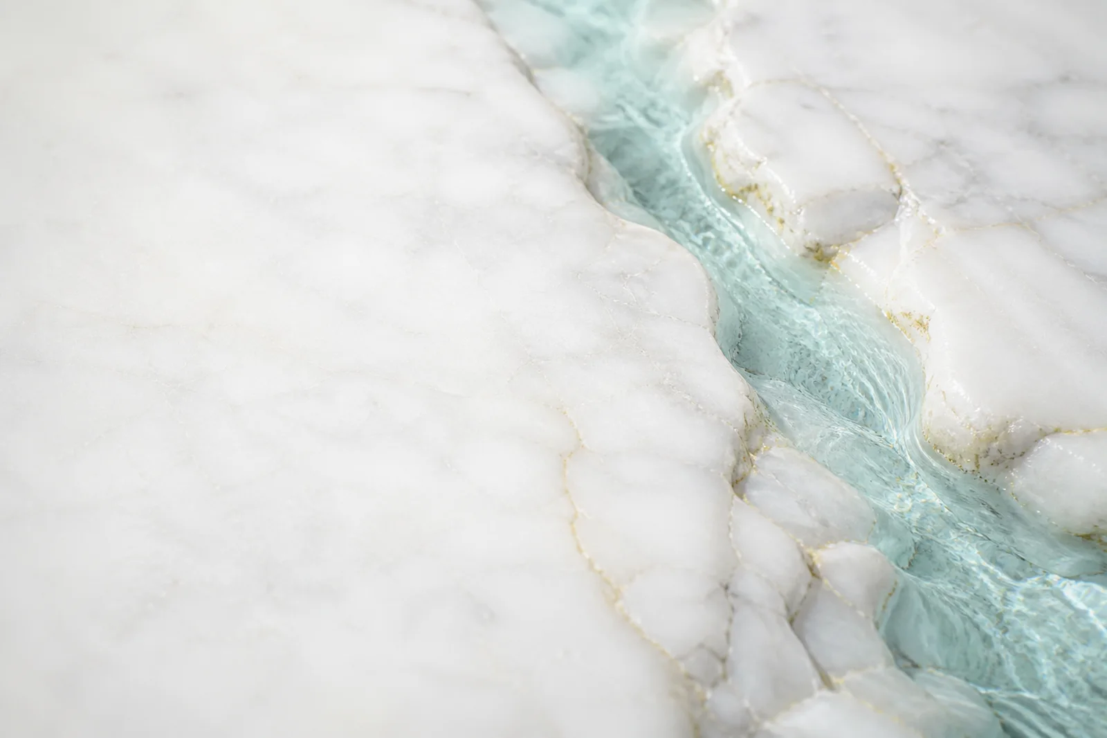 Premium light material background with white marble, a pale aqua vein, and refined organic texture