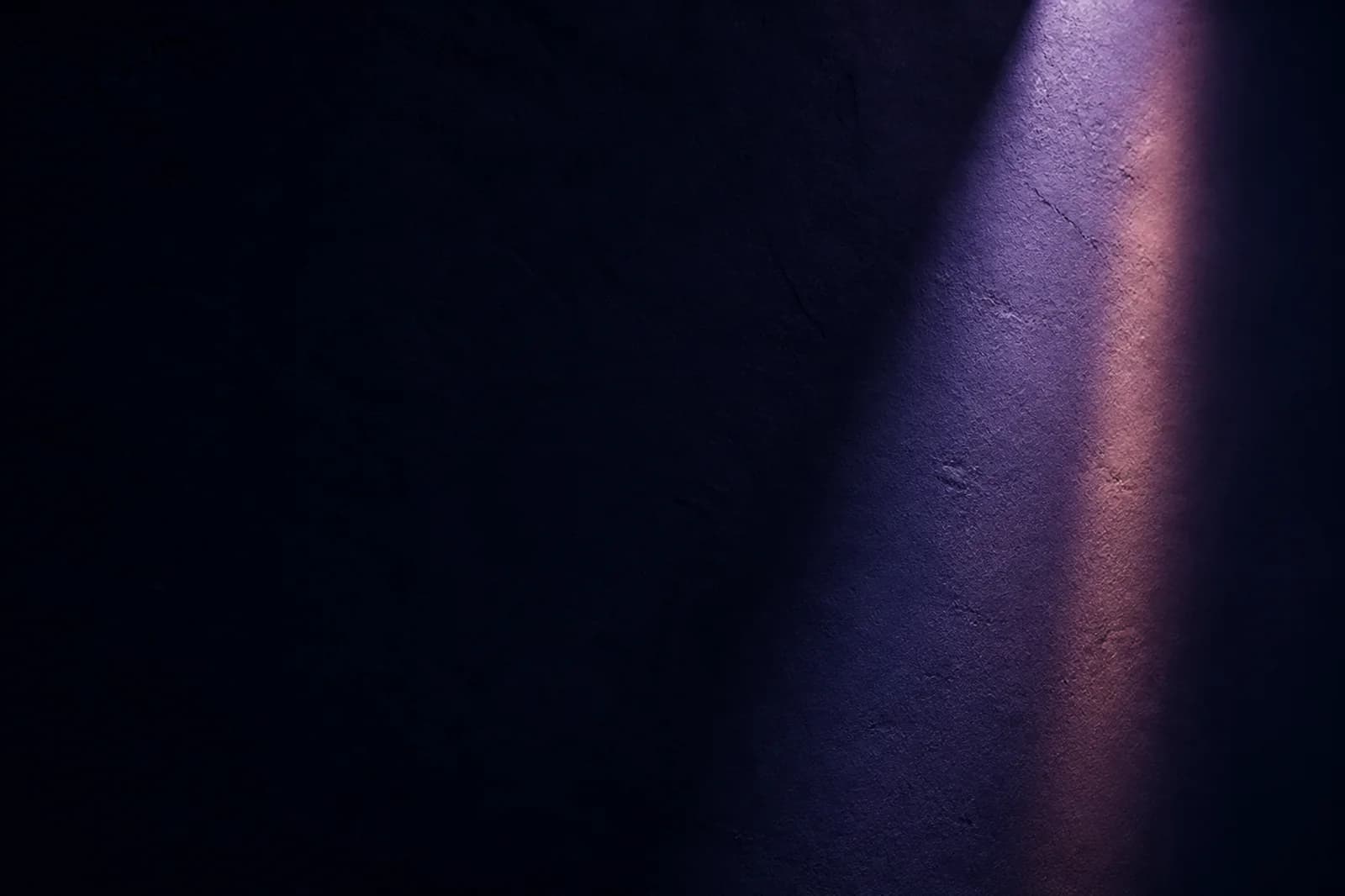 Premium dark website background with a violet architectural light beam, navy plaster texture, and clean copy space